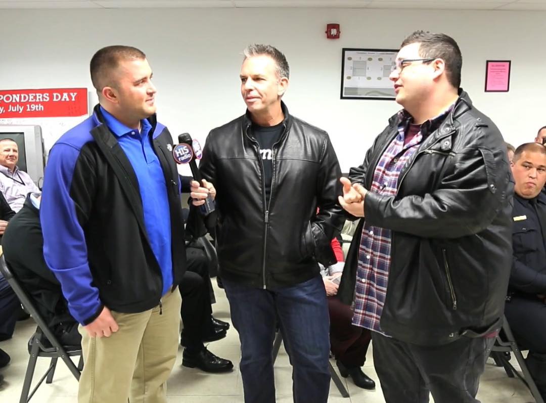 Deputy Matt Holman (Left) beiing interviewed about the story by HIS Radio Image Credit: Instagram