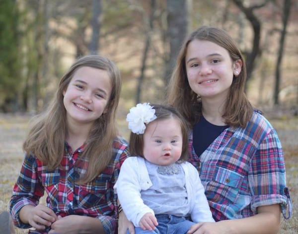 Courtney's three beautiful daughters pose for a picture. Image via Parker Myles
