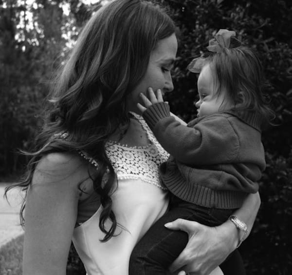 Courtney and her beautiful baby Emmy. Image via Parker Myles