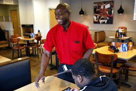 Pictured above is Johann, warmly welcoming customers to IHOP.