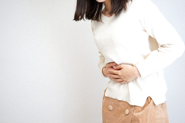 Young Woman suffer from stomachache