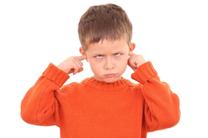 I don't hear you! 5-6 years old boy isolated on white