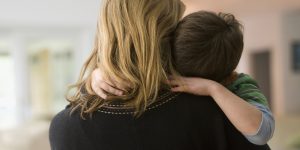 Caucasian mother comforting son