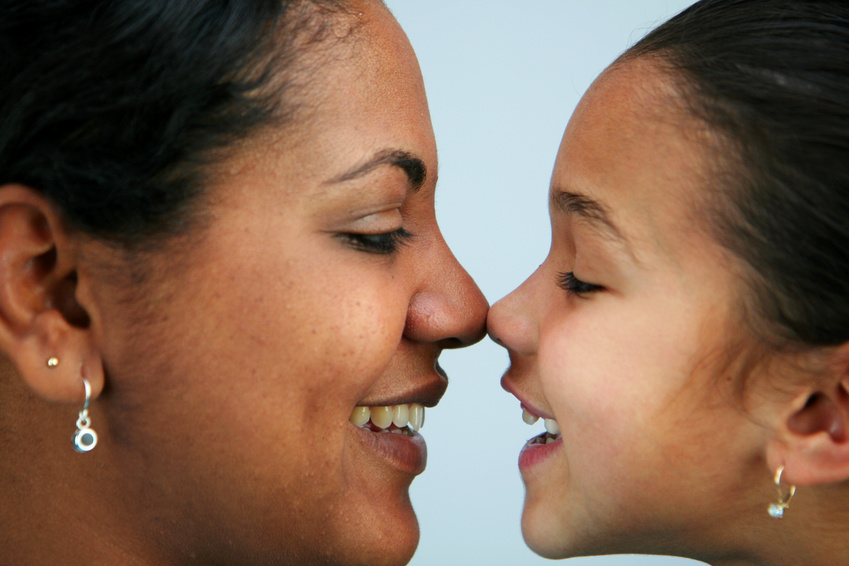 Mom and daughter with faces together