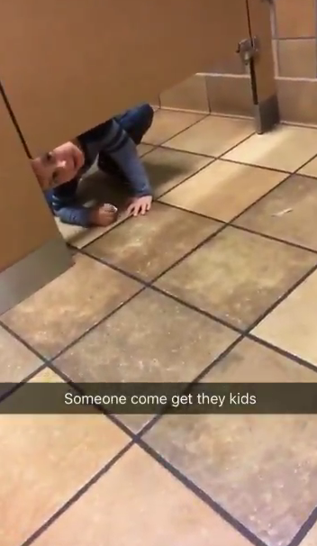 Andrew Hall filmed the moment he got an unexpected visit from an adorable little boy as he was using a public toilet