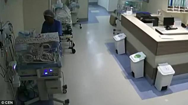 Â Santos, who denies the allegations, then returns and grabs an object from the top of the incubator and, it is claimed, uses it to tamper with the newborn child