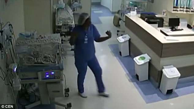 In the security footage Santos can be seen walking past a baby in an incubator when she turns around and appears to remove something from the apparatusÂ