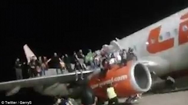 Hoax:Â Footage shows dozens standing on the right wing as panic broke out on the Lion Air Boeing 737, which was due to carry 189 passengers to Jakarta on Monday night