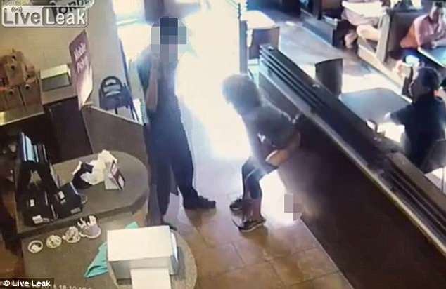 The employee is seen standing next to her as he calls his police, but quickly moves away when the feces dropped (muzzed on the floor)