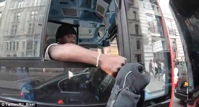 The driver can be seen giving the rider the thumbs-up before they share a fist bump. The video prompted social media users to commend the driver for his calm warning to the rider