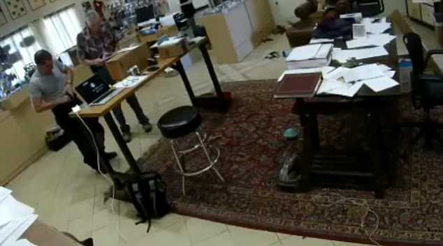 A man was caught on video accidentally shooting himself in the groin, pictured tucking his Glock into his pants after loading itÂ