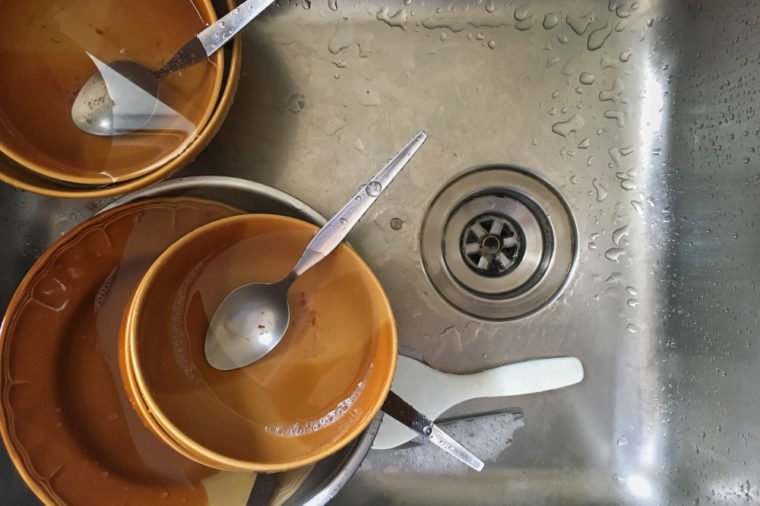 The empty dirty plate. Eaten food. It was delicious on the sink .Top view
