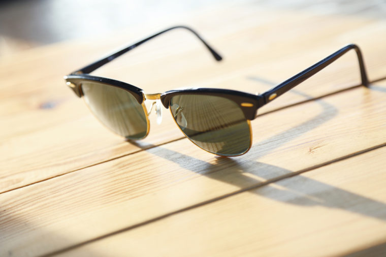 Fashion sunglasses on a wood table