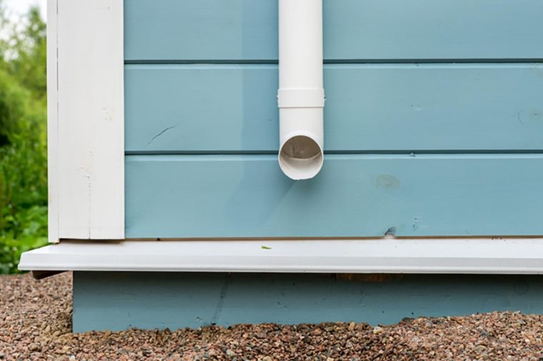 Rain gutter on the wooden house
