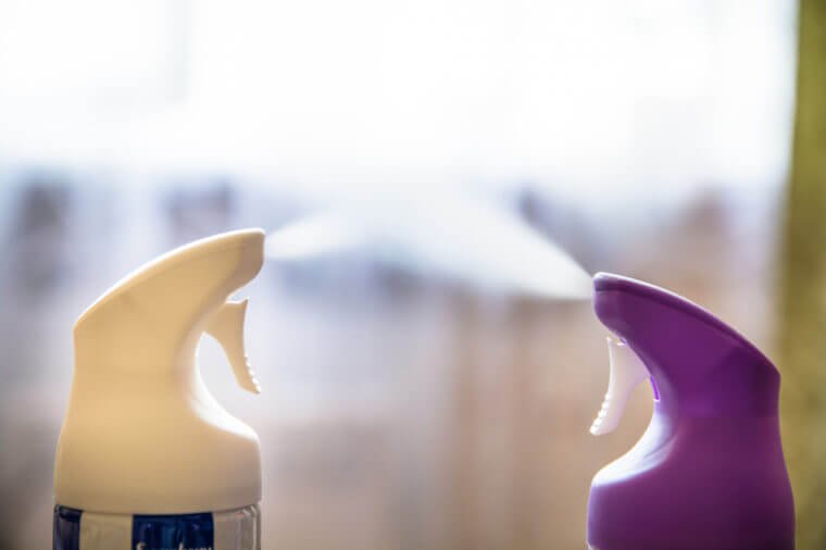 Two cylinder of air freshener in a row. Air fresheners in action.