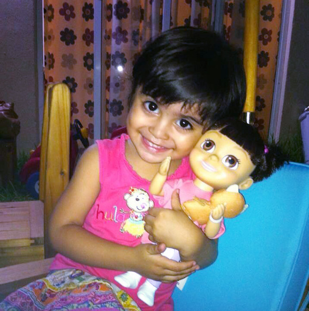 Girl With He Look Alike Doll