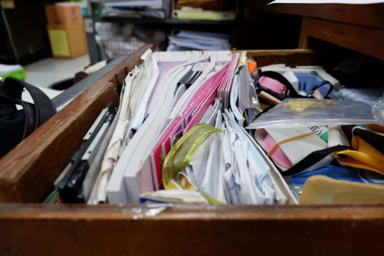 Opened drawer wooden table at workplace