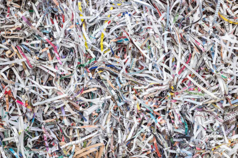 Close up stack of scrap paper from paper cutter for background