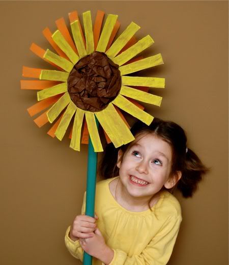 Giant sunflowers! Love! Made from empty oatmeal canisters, paint and tissue paper