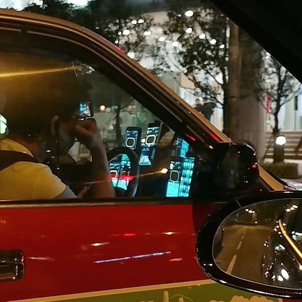 Can You Still See The Road When Half The Windscreen Is Covered In Phones? Also, Don