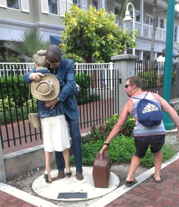  Funny People posing with statues 