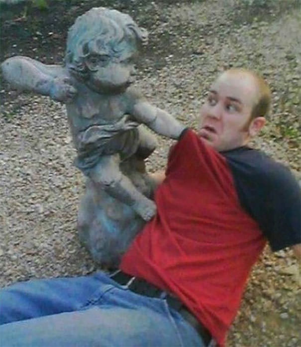  Funny People posing with statues 