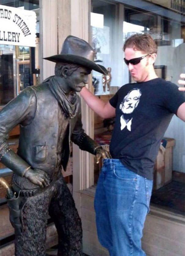  Funny People posing with statues 