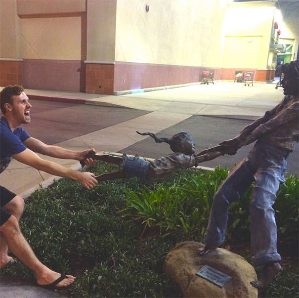  Funny People posing with statues 