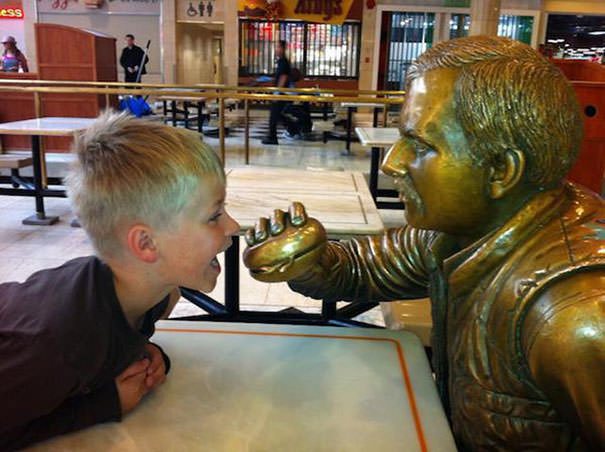  Funny People posing with statues 