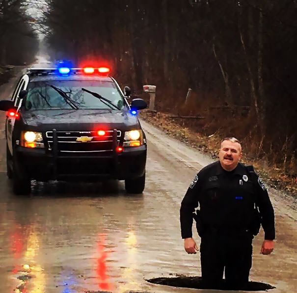  So We Found A Pothole. Just For A Little Perspective, Officer Clark Is 6