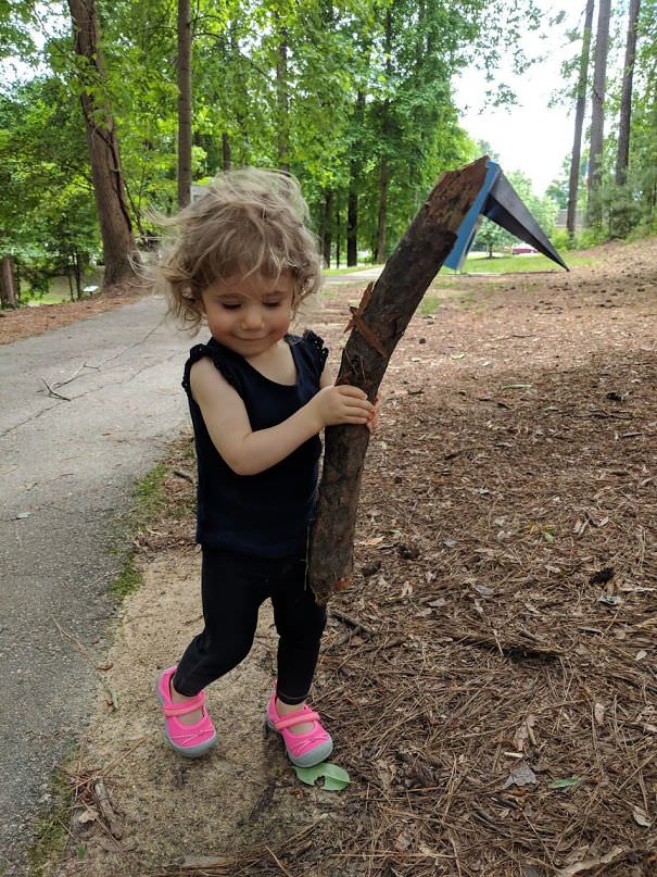 The Art In The Background Makes Appear Like My 1-Year-Old Daughter Is Holding Some Kind Of Melee Weapon