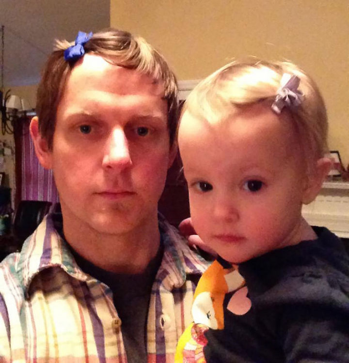 16 Super Dads Are Heroes to Their Kids - This little cutie likes her daddy to wear hair bows just like her.