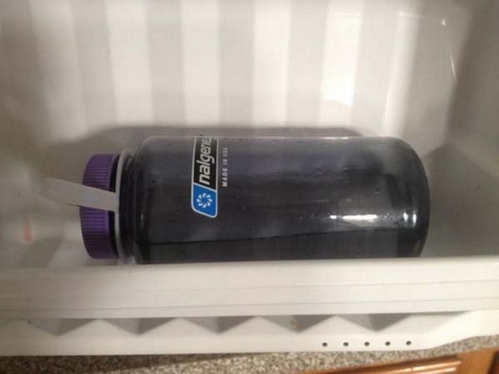 17 Kitchen Hacks - Fill your water bottle halfway and store it in the freezer on it