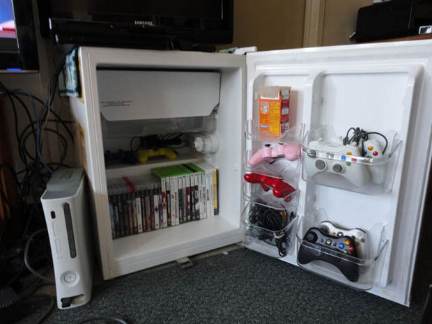 18 Upcycling Ideas - Instead of throwing out a broken refrigerator, use it to store your games and as a TV stand.