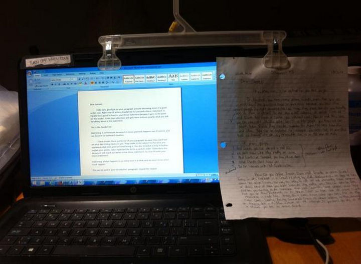 51 Crazy Life Hacks - Use a closet hanger as a copy holder.