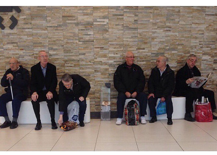 Miserable men shopping 