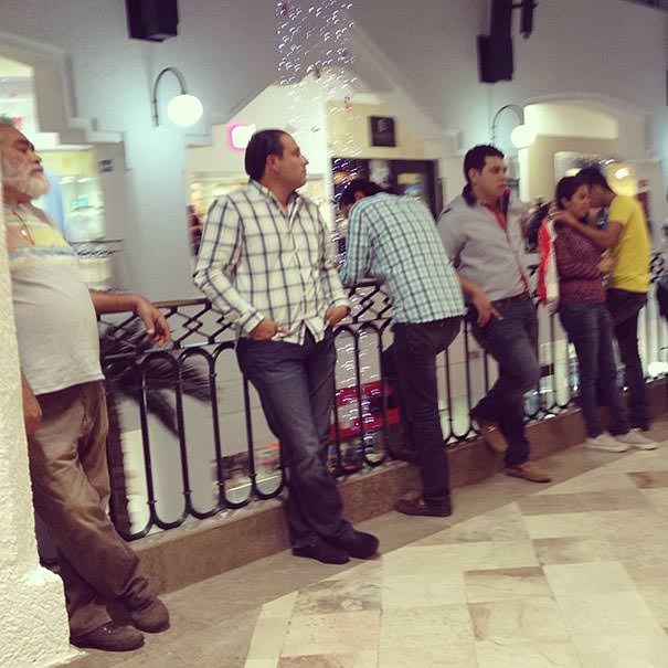 Miserable men shopping 