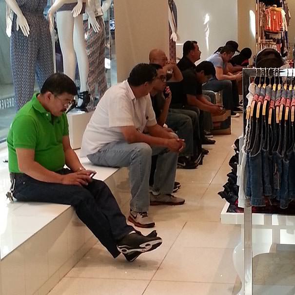 Miserable men shopping 