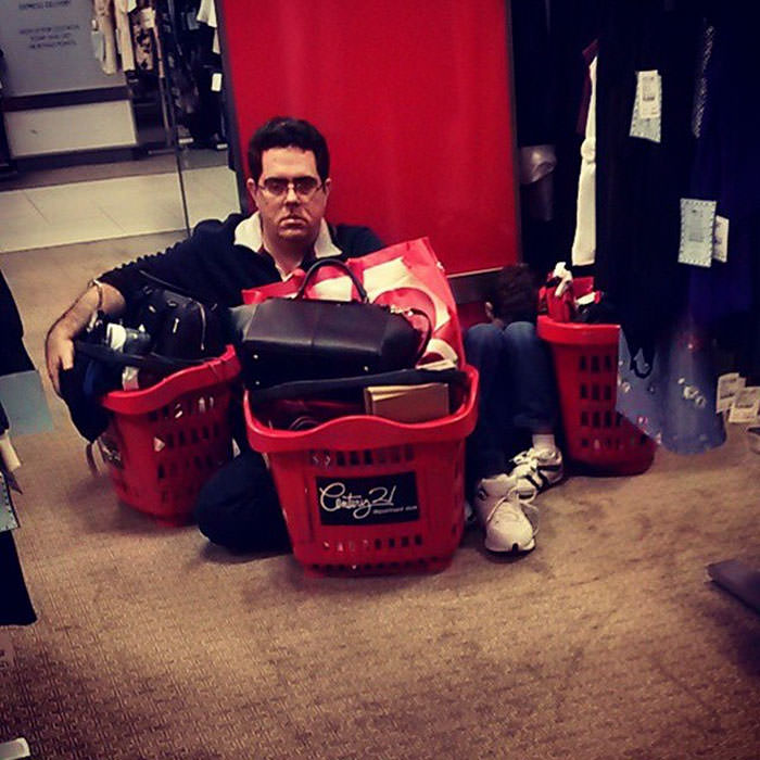 Miserable men shopping 