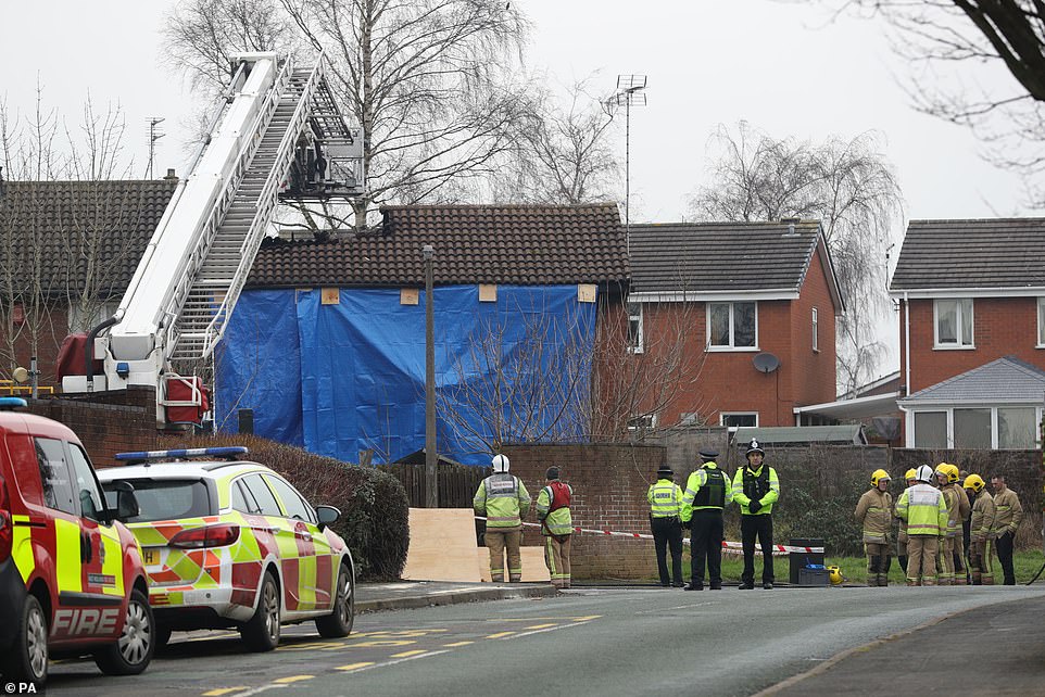 The house was covered in tarpaulin this morning as investigators try to determine the cause
