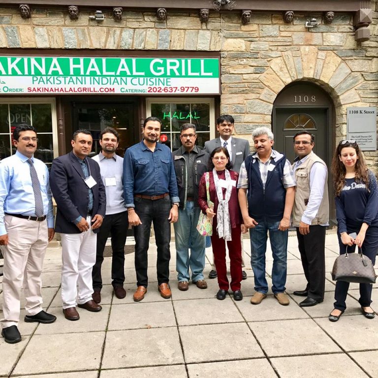 Image may contain: 11 people, people smiling, people standing