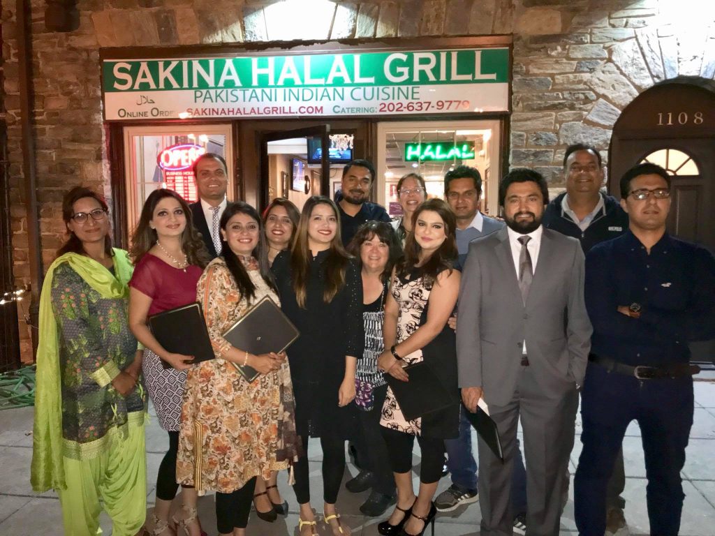 Image may contain: 14 people, people smiling, people standing