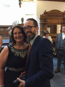 Image may contain: 3 people, people smiling, people standing and beard