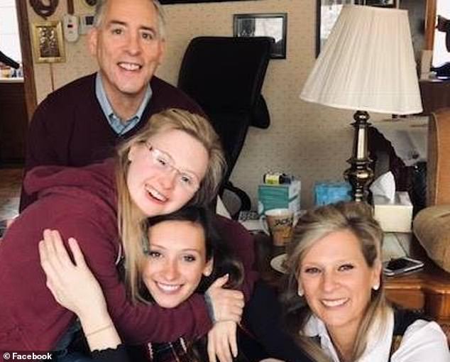Supportive: Linda (right) and Jeff (top left) were also told that their daughter Grace, pictured with younger sister Laine (center), would never learn to read or write