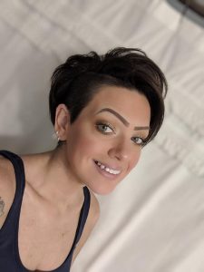 Image may contain: 1 person, smiling, close-up