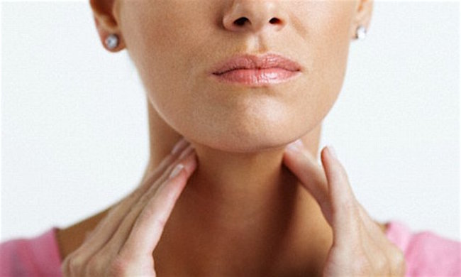 Woman With Sore Throat --- Image by © Sean Justice/Corbis