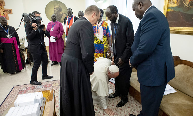 Image result for pope kisses south sudan leaders feet 750