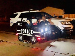 Image may contain: 2 people, people smiling, car and outdoor