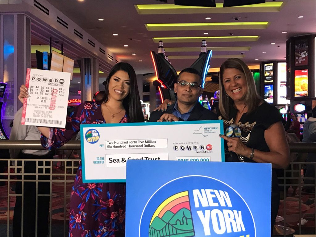 Image may contain: 3 people, people smiling, indoor