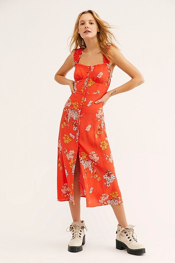 Promising review: &quot;I purchased this in the reddish-orange combo and it’s very pretty and flirty. I love it! I may purchase the black combo. I put it with hiking style boots for a casual look and it&#x27;ll go great with some strappy heels to dress it up. I believe it runs large. I am 5’3&quot; and there’s no need for alterations except the straps are a hint long but nothing unbearable. I’m a size 2 and curvy (good boob coverage) and ordered XS and it’s a looser fitting style dress.&quot; —CatladyPrice: .95 (originally 8, available in sizes XS-XL and in red and midnight)